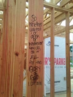 some wooden planks with graffiti on them in the middle of a construction project that is being built