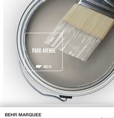 a can of paint with the words park avenue painted on it and an image of a brush