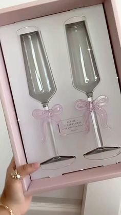 two wine glasses in a pink box with ribbon