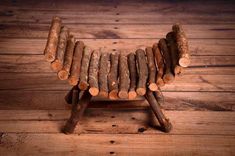 a small wooden animal made out of logs