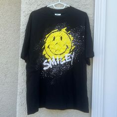 Smiley X H&M Smiley Face Splatter Face Oversized Black Tshirt Women's Size M New With Tags! #4 32824 Gw-C Trendy Yellow T-shirt For Streetwear, Yellow Graphic Tee With Graffiti Print, Casual Yellow Tops With Graffiti Print, Black Smiley Face Crew Neck T-shirt, Black Smiley Face Crew Neck Top, Black Crew Neck Top With Smiley Face, Black Crew Neck T-shirt With Smiley Face, Graphic Tee With Paint Splatter For Streetwear, Streetwear Paint Splatter Graphic Tee