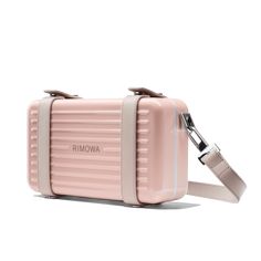 Pre-order from 11/19 Made in Germany and crafted in ultra-lightweight, dent-resistant grooved polycarbonate, the RIMOWA Personal in Desert Rose Pink is a unisex hard-shell crossbody bag meant to house and transport your daily personal essentials. It can be worn with the detachable, adjustable leather body strap or carried like a clutch. Each detail of the RIMOWA Personal in Desert Rose Pink is carefully considered from its color-matched straps and leather lining down to its metal rivets, rings, Store Image, Desert Rose, Personal Marketing, Rose Pink, White Bag, Rivets, Full Grain Leather, Italian Leather, Luggage Bags