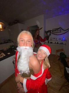 two people dressed up as santa clause and mrs claus