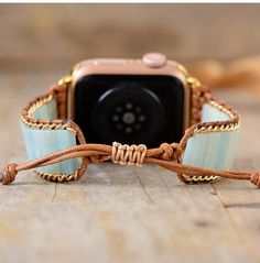 Amazonite Beaded Apple Watch Band Upgrade your apple watch! Refresh and personalize your smartwatch with our unique beaded straps. Our smartwatch band is beautifully handcrafted using high-quality natural Amazonite stones loomed on natural brown cord. It comes with an adjustable closure to fit most wrist sizes. ﻿Our boho apple watch band is the perfect gift for yourself, the independent, or the free spirited. Get the benefits of the natural stones while wearing these trendy beaded watch bands: C Beaded Watches, Apple Watch Bracelets, Apple Band, Watch Band Bracelet, Bracelet Apple Watch, Lapis Lazuli Jewelry, Tiger Eye Jewelry, Rose Quartz Jewelry, Amazonite Stone