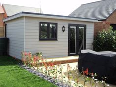 a small backyard with a covered patio area