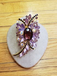 "1950s, 4\" long and 2\" wide, amethyst glass and pink rhinestone ornate brooch ,with gold tone molded back. Condition excellent Price $ 85" Gemstone Brooch, Vintage Jewellery Rings, Feb 8, Glass Buttons, Rhinestone Jewelry, Pink Rhinestones, Vintage Brooches, Kitsch, Costume Jewelry