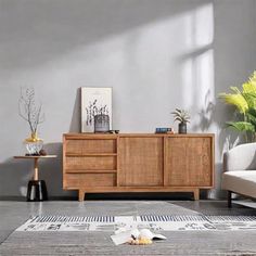 a living room scene with focus on the sideboard and rug in the foreground