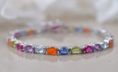 14K Gold Colorful Tennis Bracelet, Bridal bracelet, Multi Gemstone Bracelet, Line Bracelet, Anniversary Gifts, Oval Shaped Women Bracelets Gemstone- Multi Gemstone  Shape-Size- Oval 6X4MM  Metal- 925 Sterling Silver Finish Type- Choose From Above customisation (like colour choices) included in the listing, the photos shown are just reference. Oval Multicolor Gemstones With Accents, Multicolor Oval Bracelets With Natural Stones, Oval Multicolor Gemstones For Gift, Oval Multicolor Natural Stones Gemstones, Bracelets Gemstone, Multi Gemstone Bracelet, Women Bracelets, Wedding Jewelry Bracelets, Bridal Bracelet