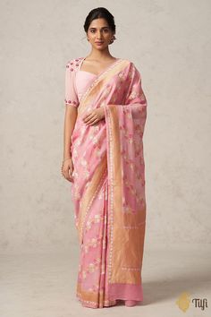 "A delightful Georgette silk saree adorned with diagonally cascading rose vines rendered in pink and white resham and roopa sona zari. The drape has been hand-dyed and brush-painted in dainty shades of soft pink, evocative of roses in full bloom.\u00a0\n\n\nColor - Shades of Soft Pink\u00a0\n\n\nFabric - Light and airy, pure Khaddi Georgette\n\n\nTechnique - The finest Cutwork weaving technique and Meenakari artistry passed down through generations of Banarasi weavers.\u00a0\n\n\nTilfi Promise - Georgette Silk Saree, Katan Silk, Old Rose, Indian Outfit, Indian Wedding Dress, Pink Saree, Bollywood Saree, Nude Pink, Handloom Saree