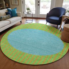 a living room with a couch, chair and rug