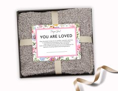 a gift box with a card that says you are loved