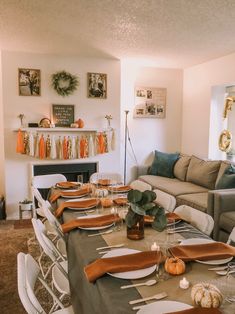 a dining room table set with place settings and place settings for the dinner party guests