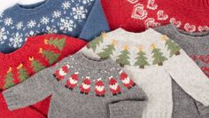 several sweaters with christmas trees and snowflakes on them