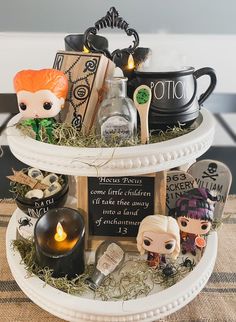 a harry potter themed halloween basket with candles and figurines