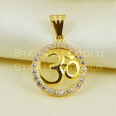 This intricately crafted gold pendant is a standout piece, designed with meticulous attention to detail. Its unique design and polished finish make it a perfect addition to any necklace, offering a personal touch and a touch of elegance. 18k Gold Pendant Handmade Jewelry,  Metal is Real Gold Purity is 18kt Full Length- 2.2 cm long approximately Full Width - 1.5 cm wide approximately Weight - 1.14 grams approx Please feel free to ask if you have any query. Return and cancelltion-  a 20% restockin 22k Gold Round Pendant Jewelry For Anniversary, Silver Jewelry With 22k Gold Round Pendant, Spiritual Silver Necklace, Om Pendent Designs Gold, Spiritual 22k Gold Round Pendant Jewelry, Om Trishul Gold Pendant, 22k Gold Spiritual Round Pendant Jewelry, Symbolic 22k Gold Pendant Necklace, Om Gold Pendant For Men