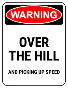 a warning sign that says, over the hill and picking up speed is not allowed