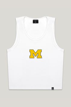 The MVP Tank for Michigan. Cute basic tank with embroidered logo. This is a hip length, slim fitting top with a scoop neckline. The MVP tank is slim fitting throughout, has an embroidered logo at the chest, and matches with anything in your closet. Select your school to make it your own! Product details and fit: Bra friendly Hip length Ribbed fabric Scoop neck Slim fitting Stretchy fabric Sleeveless Option to customize by adding embroidered logo About the model: Size: S Height: 5’1” Made to orde