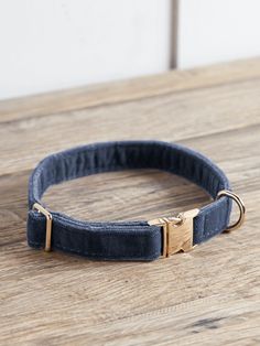 a dog collar on a wooden table