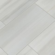 a white porcelain tile floor that looks like wood