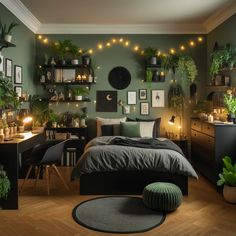 a bedroom with green walls and lots of plants on the shelves above the bed is lit by candles