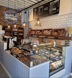 a bakery filled with lots of bread and pastries