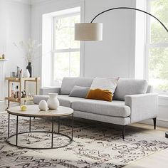 a modern living room with white walls and furniture