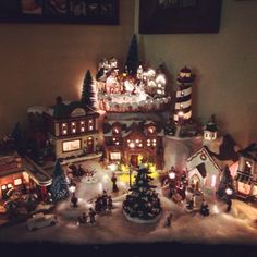 a christmas village with lit up houses and trees