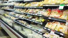 an aisle in a grocery store filled with lots of food