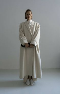 The Kosiv Cream Coat is a relaxed fit, long length coat, crafted from luxurious wool and hemp blend fabric traditionally handmade woven in Ukraine. Soft and compact to touch, this double breasted style features pleated oversize sleeves. This timeless piece is perfect for layering in the cooler seasons and will elevate any daytime or evening outfit. Lined.Composition 60% wool, 40% hempLining: 100% viscoseTrimming: 100% metalThis item is made of a blend of 40% hemp and 60% wool and it´s undyed.Hem Oversize Coat, Fits Inspiration, Cream Coat, Oversize Sleeves, Evening Outfit, Pleated Sleeves, Oversized Coat, Evening Outfits, Women Artisans