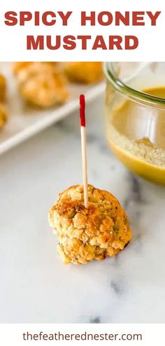 an appetizer made with honey and mustard on a stick is ready to be eaten