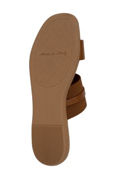 Gleaming metal hardware delivers polished style to this Italian-made slide sandal shaped by a squared-off toe. 1 /2" heel Synthetic upper, lining and sole Made in Italy Modern Brown Flat Slides, Slip-on Mules With Single Toe Strap, Trendy Leather Toe Loop Sandals, Trendy Leather Flat Mules, Leather Square Toe Slip-on Sandals, Leather Slip-on Sandals With Square Toe, Square Toe Leather Slip-on Sandals, Modern Flat Sandals With Heel Loop, Casual Leather Slides With Square Toe