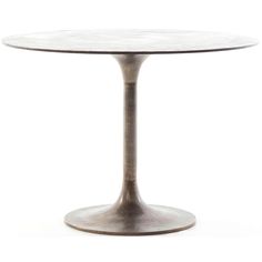 an oval marble table with metal base