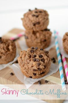 chocolate chip muffins on a cutting board with a straw