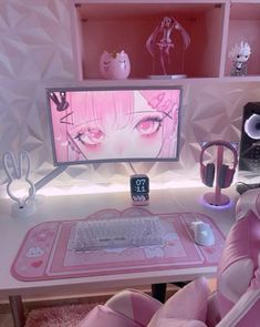 a desk with a computer, keyboard and mouse on it in front of a pink wall