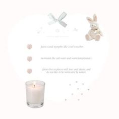 a white candle with a bunny on it next to a small teddy bear and some hearts