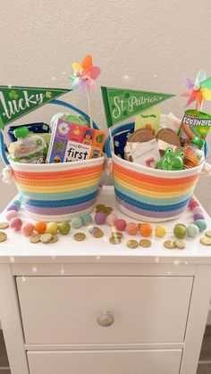 two baskets filled with candy sitting on top of a table