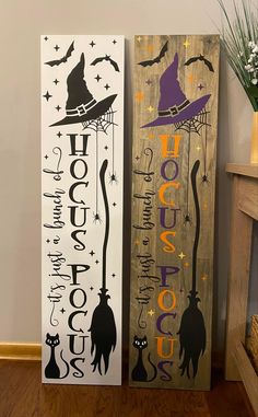 two wooden signs with witches on them