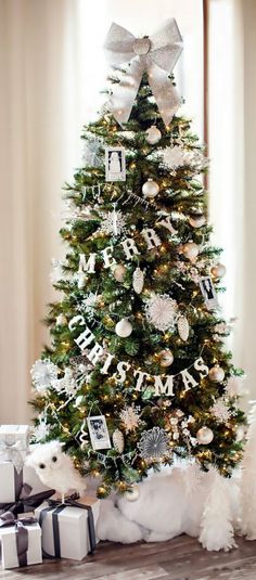 a decorated christmas tree with presents under it