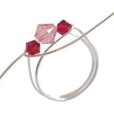 three red glass beads on a silver wire