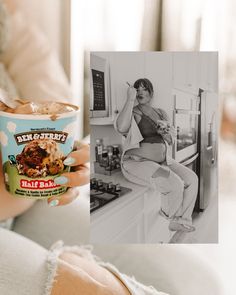 a woman sitting on a kitchen counter holding a cup of ice cream