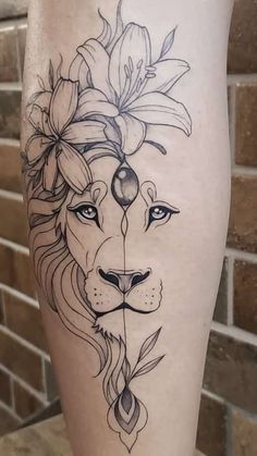 a woman's leg with a lion and flowers on her head, in front of a brick wall