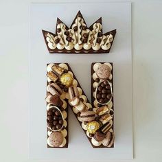 the letter n is made up of chocolates and marshmallows, along with other sweets