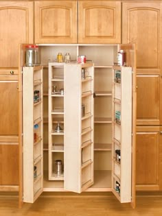 an open cabinet in the middle of a kitchen