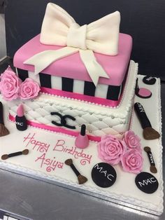 a birthday cake with pink and white decorations