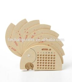 an alarm clock with five pieces of wood on it's sides and the numbers in red