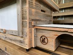 a close up of a wooden structure with windows