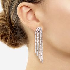 Strings of sparkling diamonds delicately hang at graduating lengths in these striking statement earrings. Dazzling Brilliant Cut Chandelier Earrings For Evening, Dazzling Chandelier Earrings With Brilliant Cut For Evening, Luxury Bridal Dangle Earrings With Sparkling Stones, Glamorous Diamond Dangle Earrings, Glamorous Dangle Diamond Earrings, Bridal Dangle Earrings With Diamond Cut, Brilliant Cut Diamond Chandelier Earrings For Evening, Party Diamond Drop Earrings With Brilliant Cut, Diamond Cut Dangle Earrings For Party