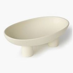 a white bowl sitting on top of a table