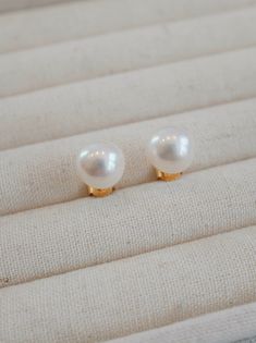 The "Aurora" Akoya Pearl Stud Earrings—You’ve seen pearls before, perhaps you’ve worn them, but not like this. These are quiet, deliberate. The kind of earrings that don’t ask for attention but command it anyway. You slip them on, and suddenly you’re in conversation with something timeless, something lasting. Materials: 18k Gold Vermeil over sterling silver, featuring premium Akoya freshwater pearls. Pearl Size: 8.5-9mm, offering a balanced and elegant statement. Hypoallergenic: Designed to be g Pearl Clip-on Earrings As Gift, Classic Pearl Earrings As Gift, White Clip-on Pearl Earrings For Gift, Single Akoya Pearl Earring As Gift, Pearl Collection, Akoya Pearls, Pearl Stud Earrings, Pearl Size, Pearl Studs