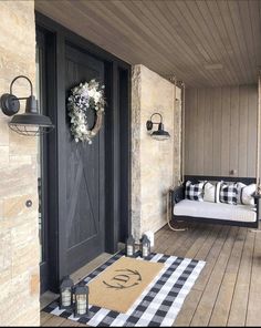 a porch decorated with black and white decor